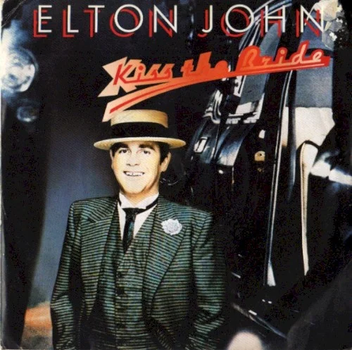 Kiss The Bride single cover by Elton John, released October 1983