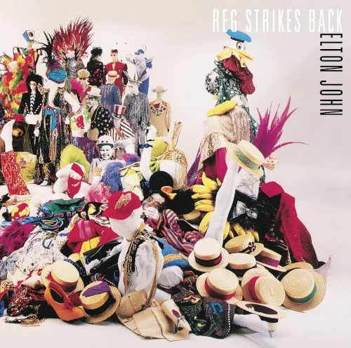 Reg Strikes Back album cover by Elton John, released June 1, 1988 on MCA Records, The Rocket Record Company, Island
