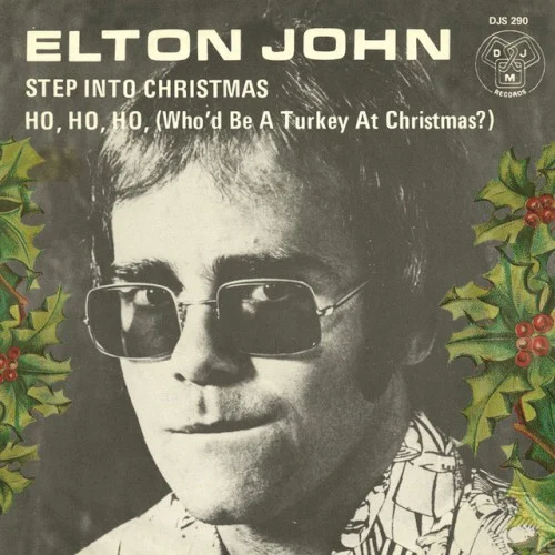 Step Into Christmas / Ho Ho Ho (Who’d Be a Turkey at Christmas?) single cover by Elton John, released November 23, 1973 on Mercury Records, MCA Records, Universal Music Recordings