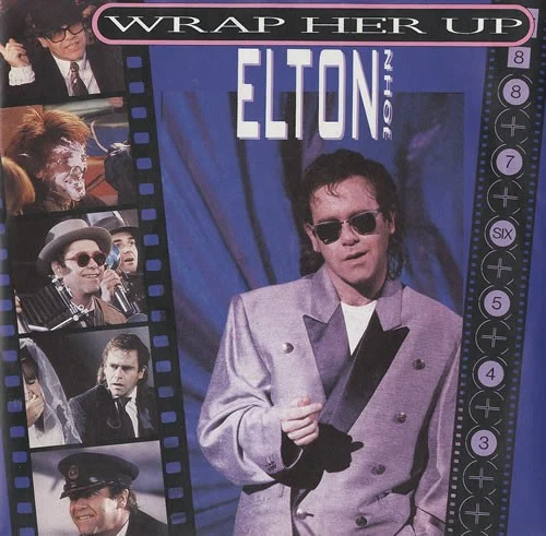 Wrap Her Up single cover by Elton John, released October 1985 on The Rocket Record Company, Geffen